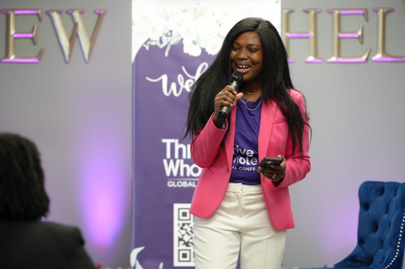 Anthoanette Kommeh speaking at the Thrive Whole conference